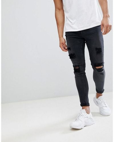 Gym King Super Skinny Jeans In Black With Distressing