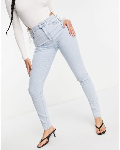 ASOS Ridley - jean skinny taille haute à joli délavage clair - Bleu