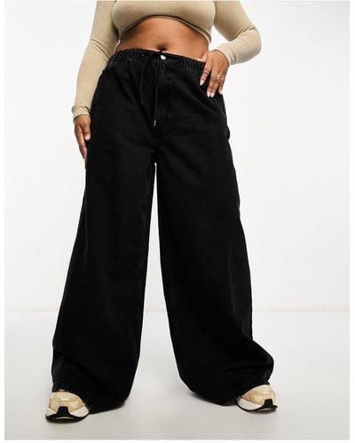 ASOS Asos design curve - jeans a fondo ampio slavato - Nero