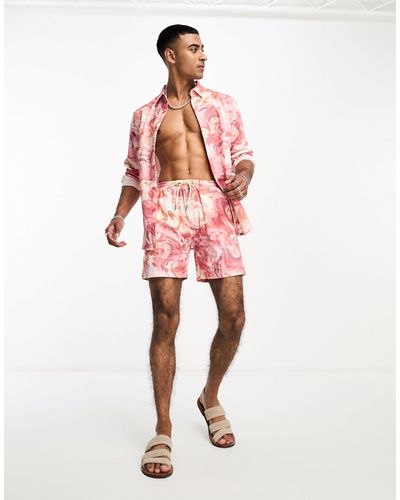 Labelrail Pantalones cortos rosa con estampado marmolado