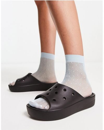 Crocs™ Sandalias negras sin cierres con plataforma - Blanco