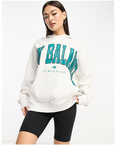 New Balance Sweat à capuche avec large logo - Blanc