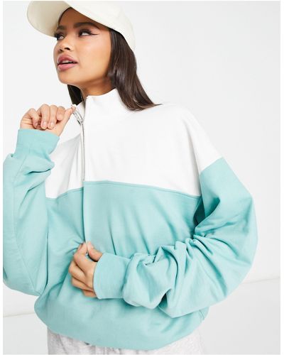 ASOS – sweatshirt mit kurzem reißverschluss und blockfarbendesign - Blau