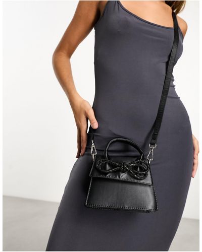 Public Desire Indy - borsetta a tracolla nera decorata con fiocco - Nero