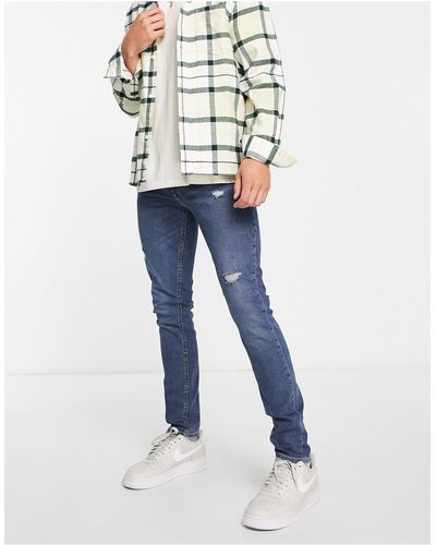 Jack & Jones Intelligence - liam - jean skinny ultra stetch à effet déchiré et réparé - moyen délavé - Bleu