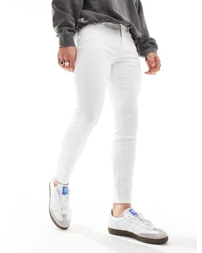ASOS Jeans spray on super elasticizzati bianchi - Bianco