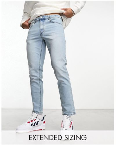 ASOS Jeans Met Smaltoelopende Pijpen - Blauw