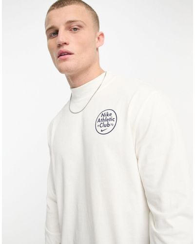 Nike Trend - t-shirt color crema con collo a lupetto - Bianco