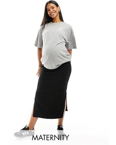 Mama.licious Mamalicious maternity - gonna di jeans premaman nera con spacchi laterali e fascia sopra il pancione - Bianco
