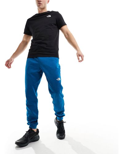 The North Face – training reaxion – jogginghose mit logo - Blau