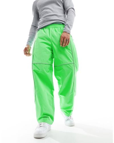 The North Face Tek Woven joggers With Reflective Piping - Green