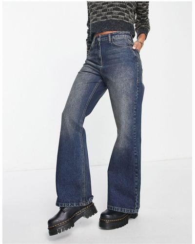 Collusion X008 - Ruimvallende Flared Jeans Met Wassing - Blauw