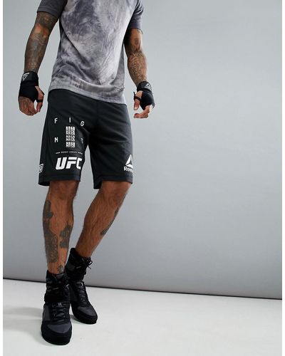 Reebok Short de combat à logo et motif UFC - Noir