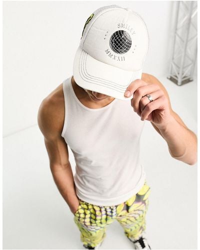 ASOS Smiley Collab Trucker Cap With Logo And Contrast Yellow Peak - White