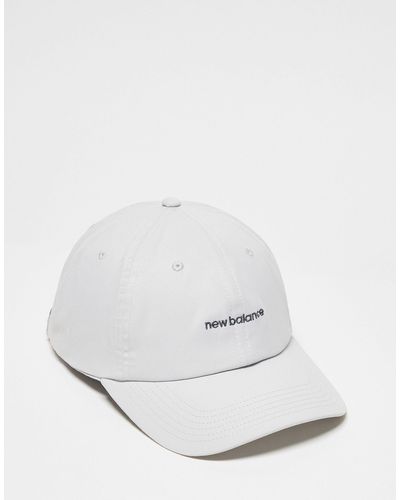 New Balance Cappellino con logo lineare - Bianco