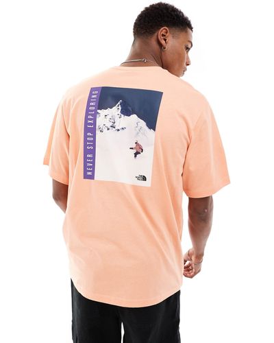 The North Face Snowboard - t-shirt con stampa rétro sulla schiena - Arancione