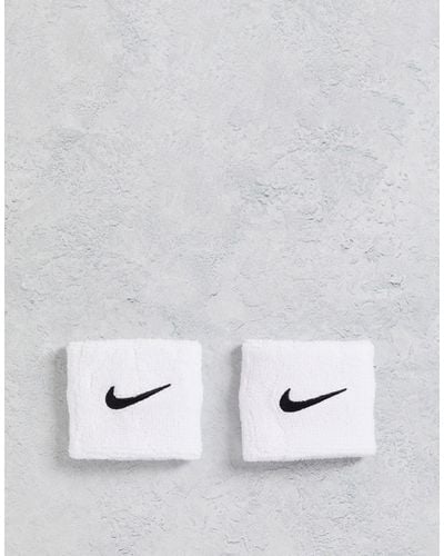 Nike Muñequeras blancas unisex con logo - Blanco