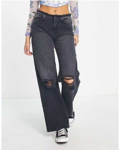 ONLY Jeans a fondo ampio con vita bassa sfrangiata neri - Nero
