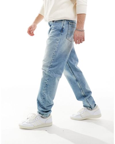 Tommy Hilfiger – isaac – lässig geschnittene, schmal zulaufende jeans - Blau