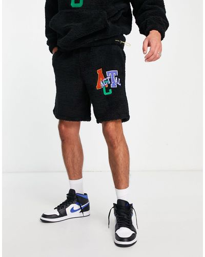 ASOS Pantalones cortos s holgados con aplicación del logo - Negro