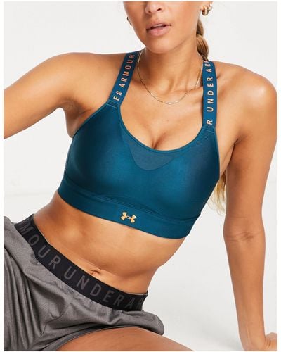 Under Armour Authentics mid support padless sports bra in blue and pink