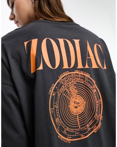 ONLY T-shirt oversize manches longues à imprimé zodiaque - Noir