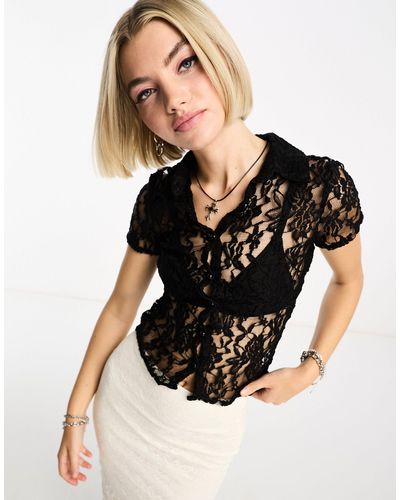 Camisa negra entallada 2025 mujer