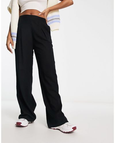 Vero Moda Pantalon large ajusté aspect lin doux - noir