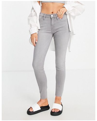 True Religion Jennie - jeans skinny a vita medio alta lavaggio chiaro con fondo grezzo - Nero