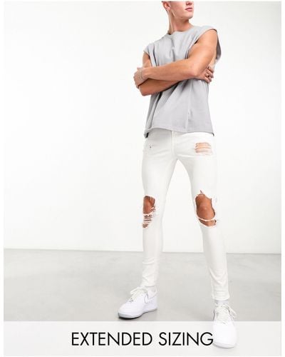 ASOS Spray On Jeans With Power Stretch With Heavy Rips - White