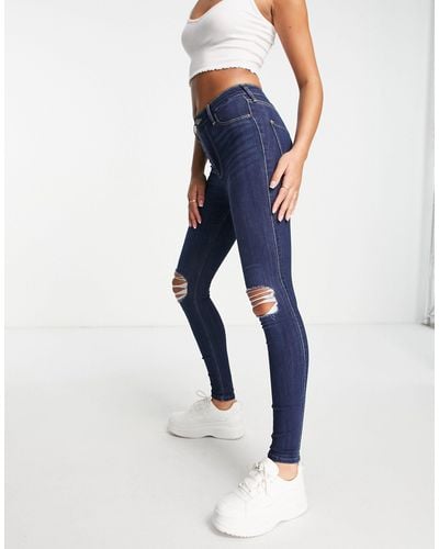 Hollister Jeans skinny color indaco con strappi - Blu