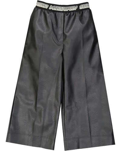 Stella McCartney Pantalones de efecto de cuero recortado de - Gris