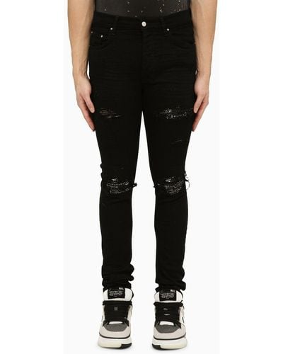 Amiri Skinny Jeans With Camouflage Patches - Black