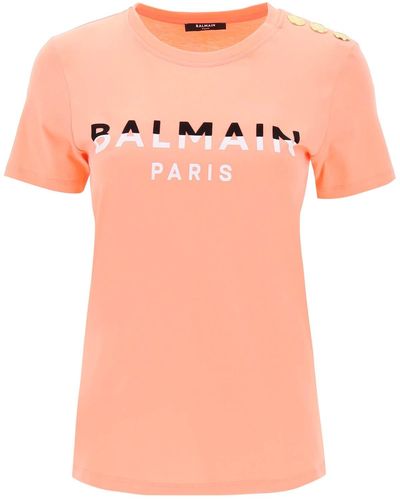 Balmain T-shirt avec imprimés afflués et boutons de ton or - Rose