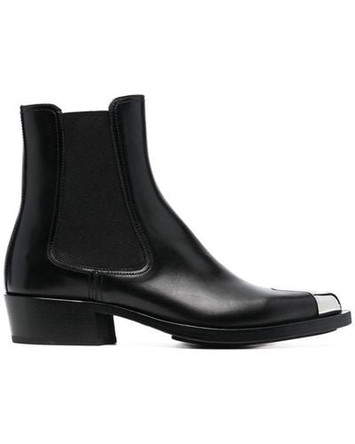 Alexander McQueen Botas de cuero con detalles dorados - Negro