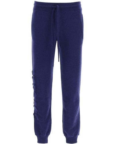 Versace Jogger Trousers With Embossed Logo - Blue