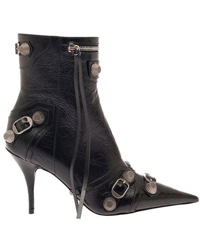 https://cdna.lystit.com/400/500/tr/photos/baltini/47c5304c/balenciaga-BLACK-cagole-Black-Pointed-Bootie-With-Studs-And-Buckles-In-Leather-Woman.jpeg
