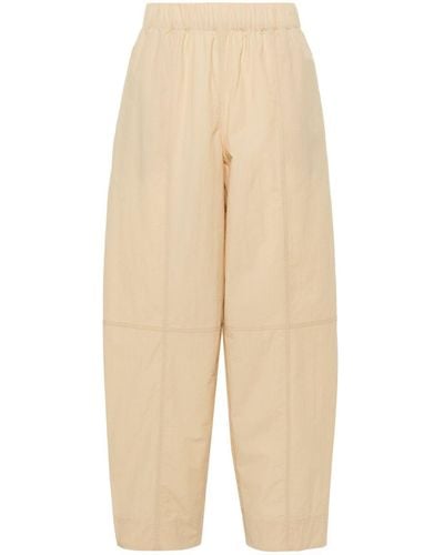 Ganni Curve Tapered-leg Trousers - Natural