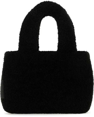 AMINA MUADDI Handbags. - Black
