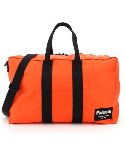 Alexander McQueen Nylon Duffle Bag With Graffiti Logo Patch - Orange