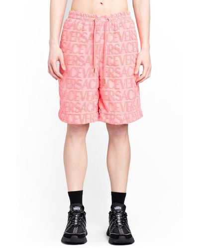 Versace Allover Logo-embossed Towel Shorts - Pink