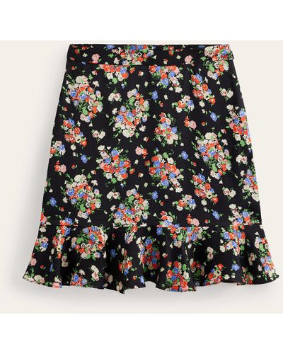 Boden Mini-jupe florale à volants en satin - Noir
