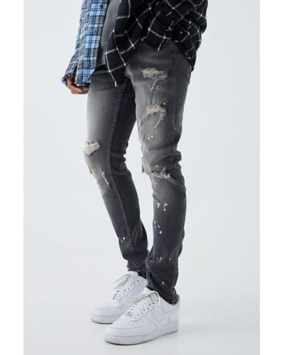 BoohooMAN Skinny Stretch Bleached Ripped Knee Jeans - Black