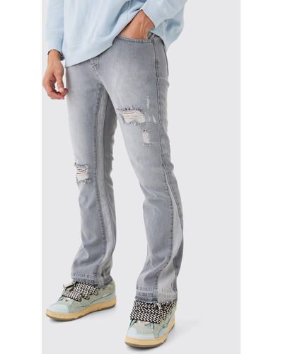 BoohooMAN Slim Flare Distressed Panel Jeans - Blue