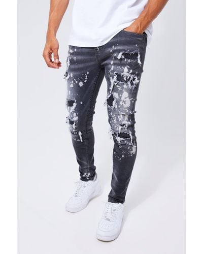 BoohooMAN Skinny Stetch All Over Ripped Bleached Jeans - Blue
