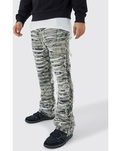 BoohooMAN Slim Stacked Flare Heavily Distressed Camo Trouser - Black