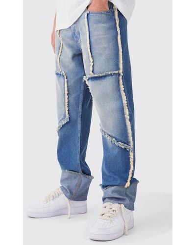 BoohooMAN Lockere Jeans mit ausgefranstem Saum - Blau