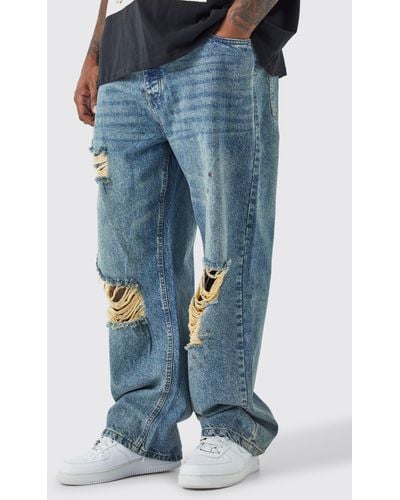 BoohooMAN Plus lockere Jeans mit Vintage-Waschung - Blau
