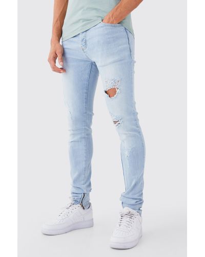 BoohooMAN Mens Skinny Stretch Stacked All Over Slash Jeans - Blue