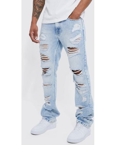 BoohooMAN Slim Flare Jeans With All Over Rips - Blue